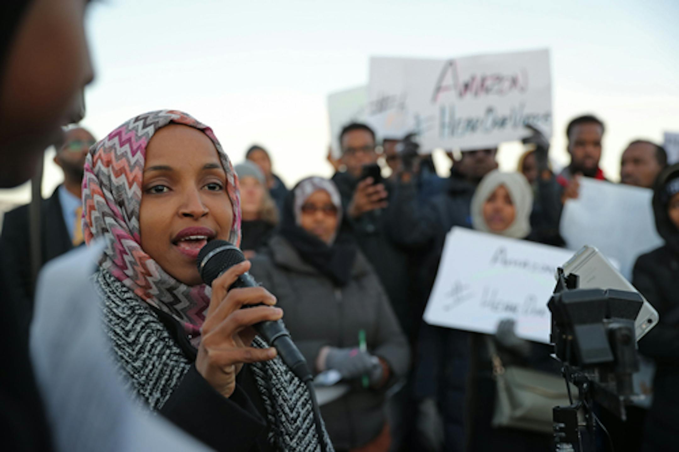 FILE- Ilhan Omar, then soon to be sworn in as a U.S. Representative, joined Somali leaders and other community members gathered outside the Amazon fulfillment center in Shakopee to protest racial disparities and working conditions in December 2018. Three Somali-American women in Minnesota have filed a lawsuit against Amazon claiming civil rights violations and retaliating against workers who participated in protests. Somali leaders with the Muslim Coalition of ISAIAH (MCI), Council on American-I