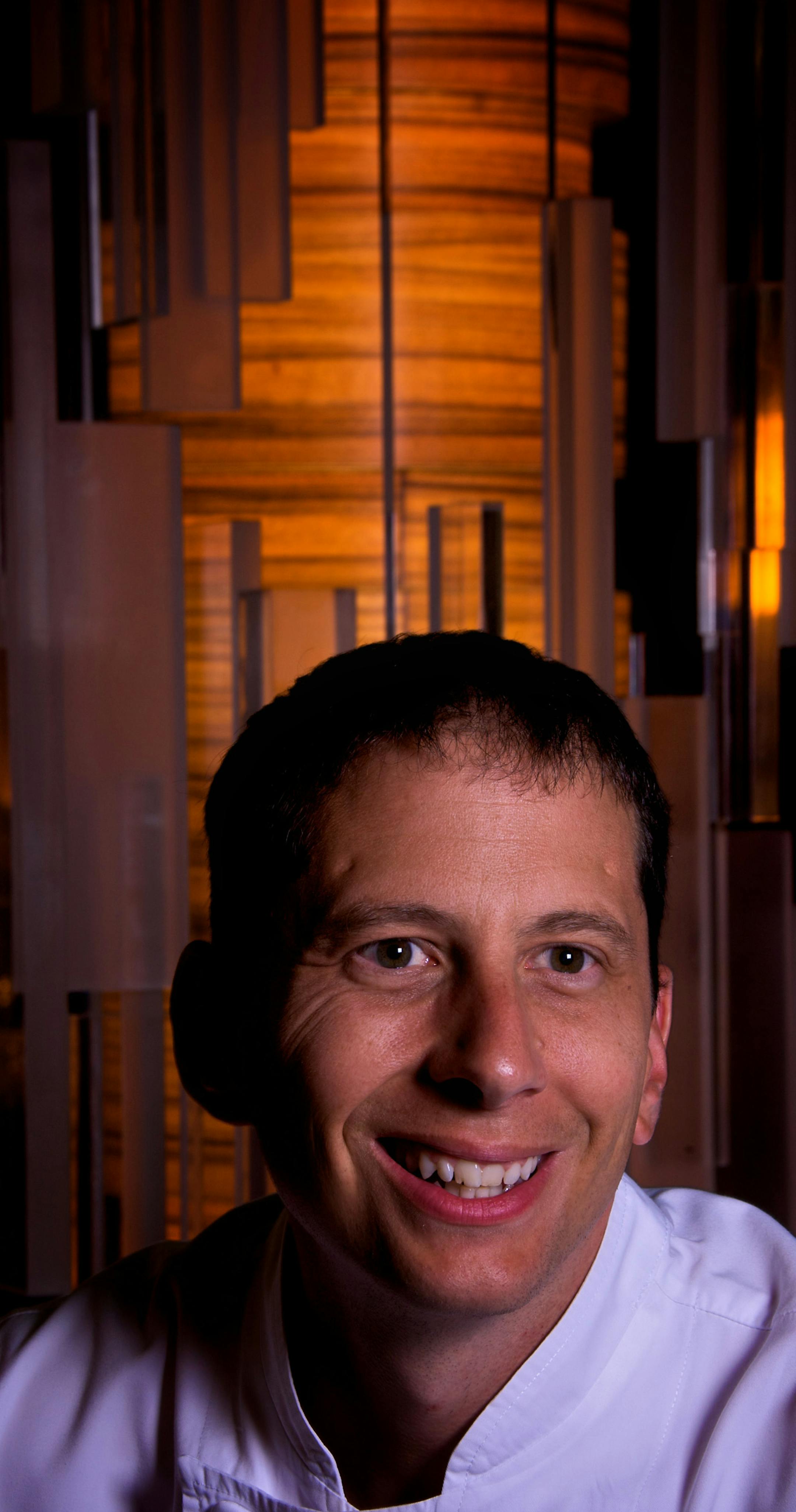 Stephen Trojahn, executive chef at Cosmos, in the restaurant's dining room.