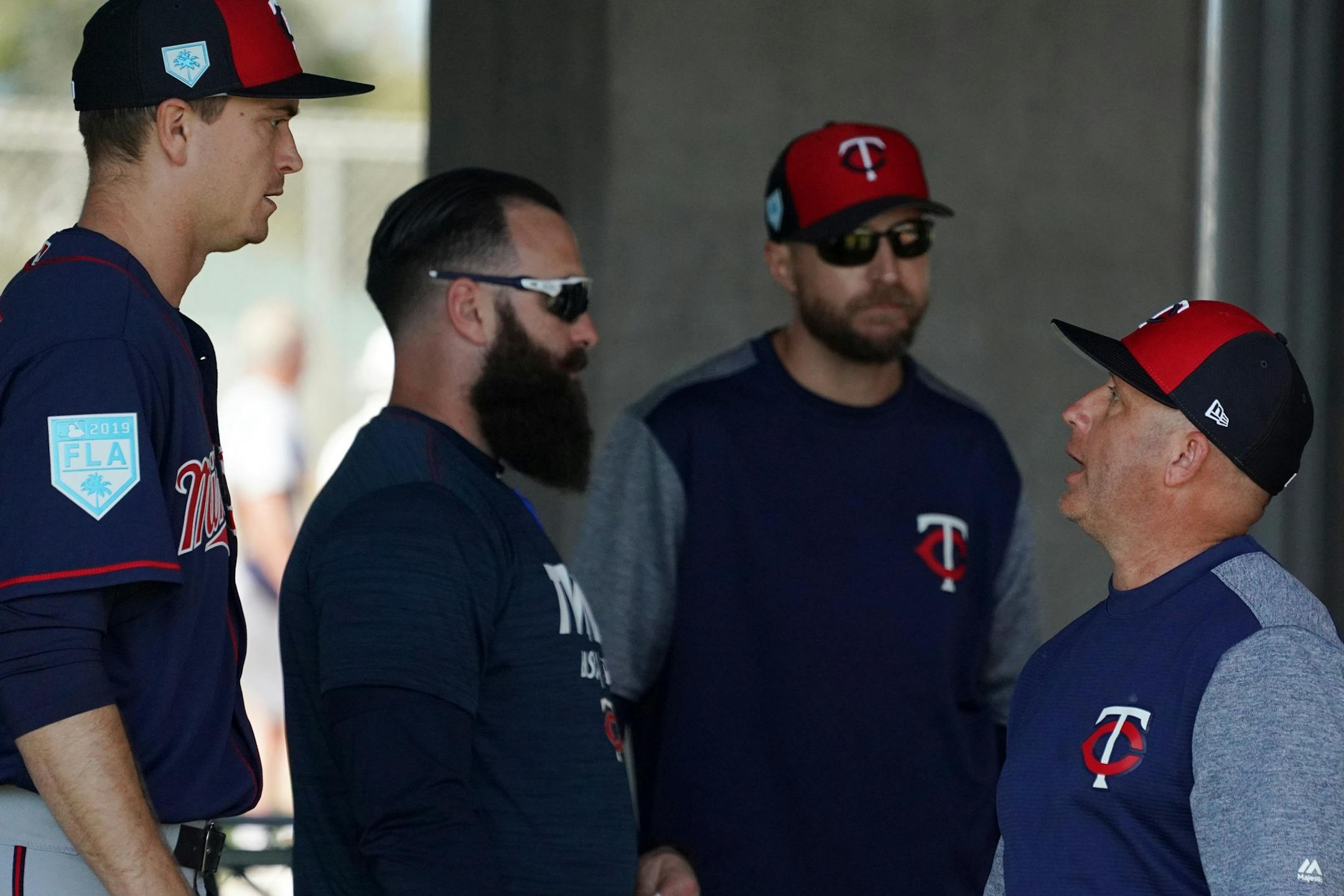 Minnesota Twins pitching coach Wes Johnson (47) talked with pitcher Kyle Gibson (44) in the bullpen Saturday.