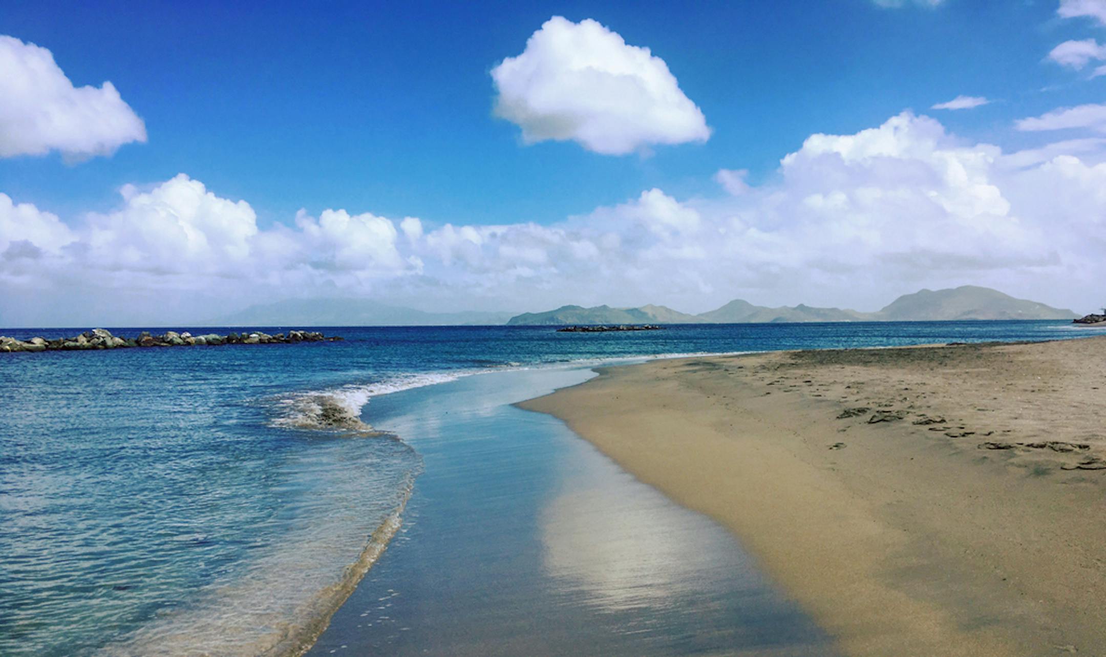 Pinney's Beach in Nevis with St. Kitts in the distance.