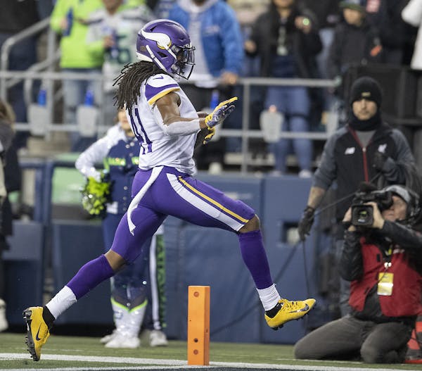 Vikings defensive back Anthony Harris jumped into the end zone for a touchdown after he intercepted the ball in the second quarter. ] ELIZABETH FLORES