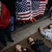 Demonstrators participate in a "lie-in" during a protest in favor of gun control reform in front of the White House, Monday, Feb. 19, 2018, in Washing