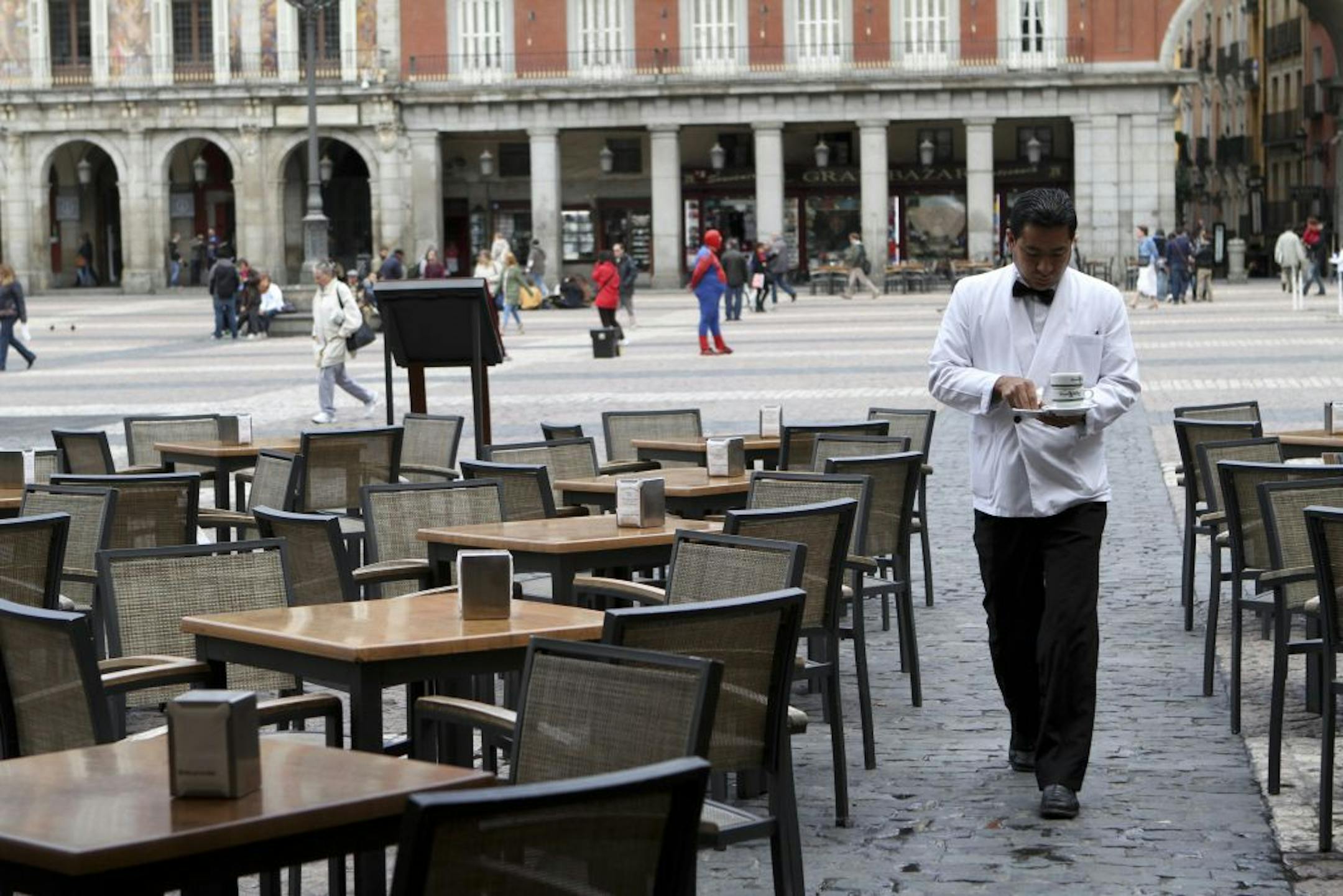 With restaurant tables – and more – idled in Spain and other parts of the EU by persistent economic problems, all eyes are on Germany's economy, which is showing signs of sputtering.