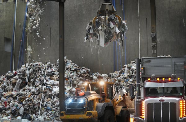 Waste is trucked in before being going into a boiler and being converted into energy at the Hennepin Energy Recovery Center in February in Minneapolis