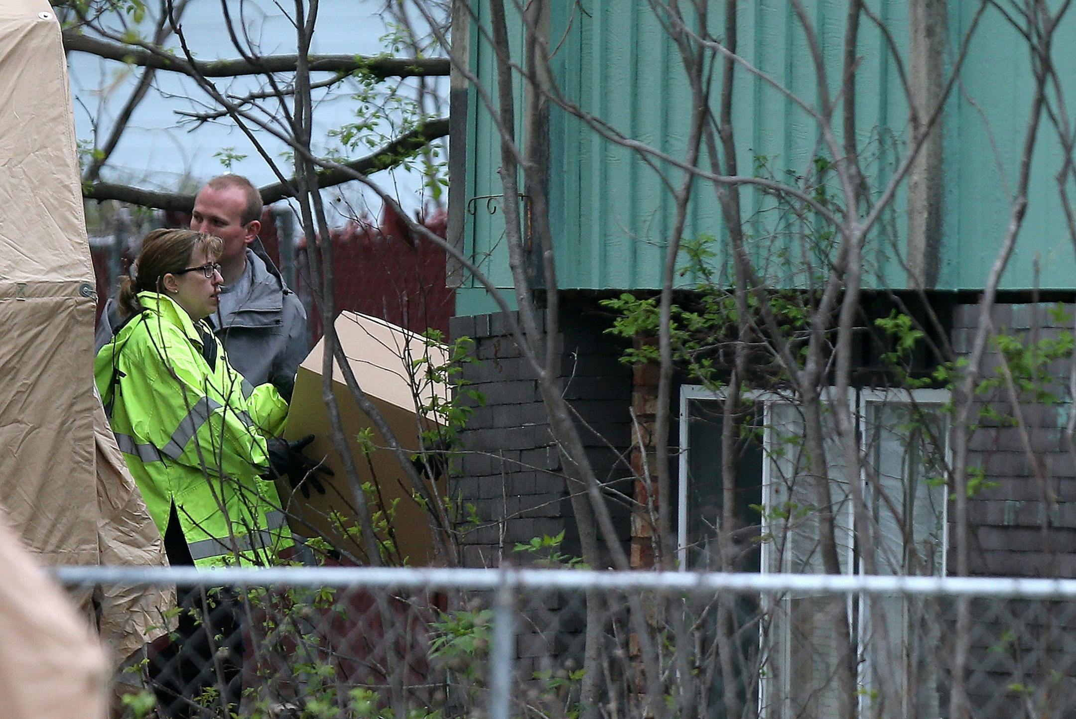 Police officials removed several items and boxes from the Pagnac property, Monday, May 19, 2014 in Maple Grove, MN. Twenty-five years after Amy Sue Pagnac went missing, Maple Grove police, the FBI and sherif's deputies searched her parent's home and property forcing the couple to leave for up to a week while excavations continued on their property.