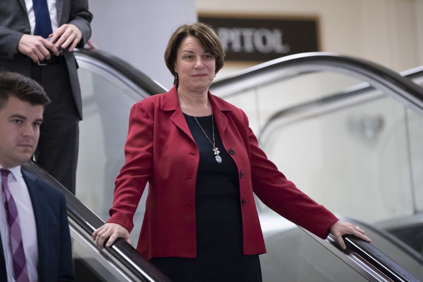 Sen. Amy Klobuchar, D-Minn., and other members of the Senate head to a closed-door briefing to update lawmakers on cyber attacks on the U.S. election system, at the Capitol in Washington, Wednesday, Aug. 22, 2018.