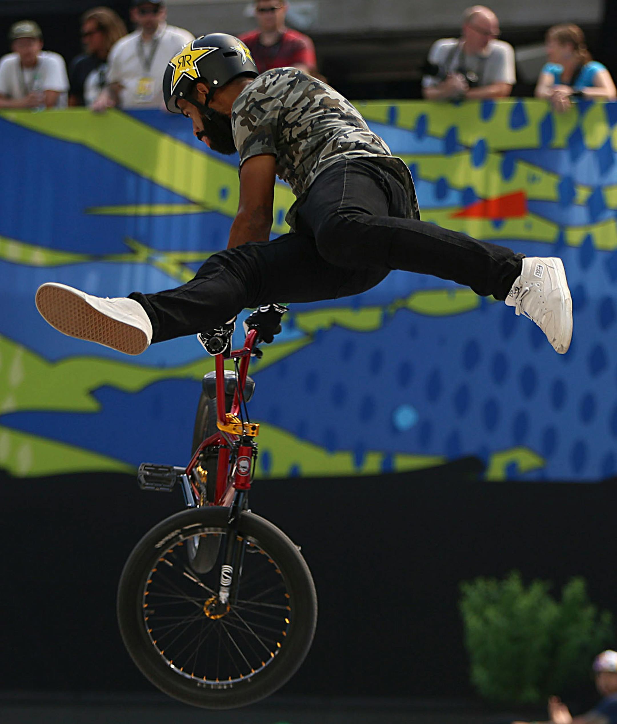 Mykel Larrin pulls off a trick with his bike during a run in the men's BMX park final.