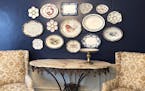 Tired of traditional art? Try using antique plates and platters as a wall display that adds texture and depth.