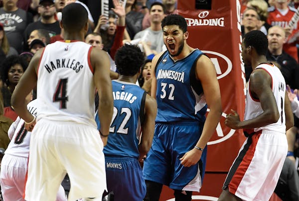 Timberwolves center Karl-Anthony Towns celebrates with Andrew Wiggins after hitting a game-winning shot last April.