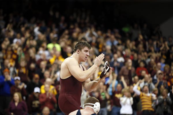Minnesota's heavyweight Tony Nelson celebrated his win of over Penn State's Jon Gingrich during Big Ten wrestling action between Minnesota and Penn St