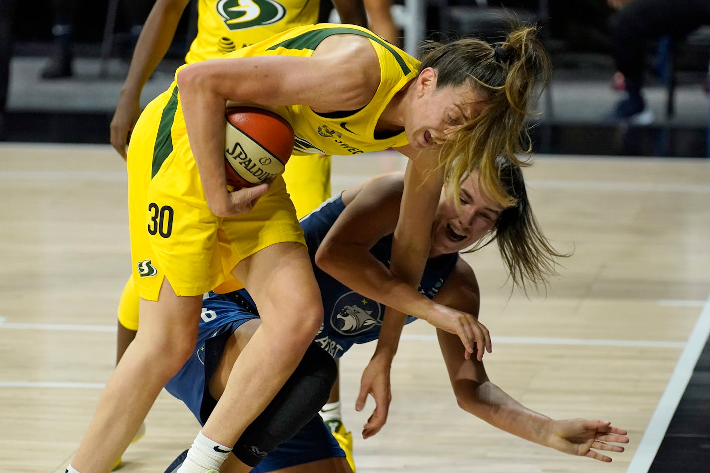 Storm forward Breanna Stewart (30) crashes into Lynx guard Bridget Carleton (6) as they chased a loose ball during the first half of Game 1 of a WNBA semifinal playoff series Tuesday.