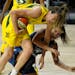 Storm forward Breanna Stewart (30) crashes into Lynx guard Bridget Carleton (6) as they chased a loose ball during the first half of Game 1 of a WNBA 