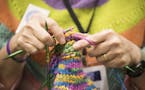 Kay Crowthers of the MN Knitter's Guild works on a pair of mittens during Vogue Knitting Live. ] (Leila Navidi/Star Tribune) leila.navidi@startribune.