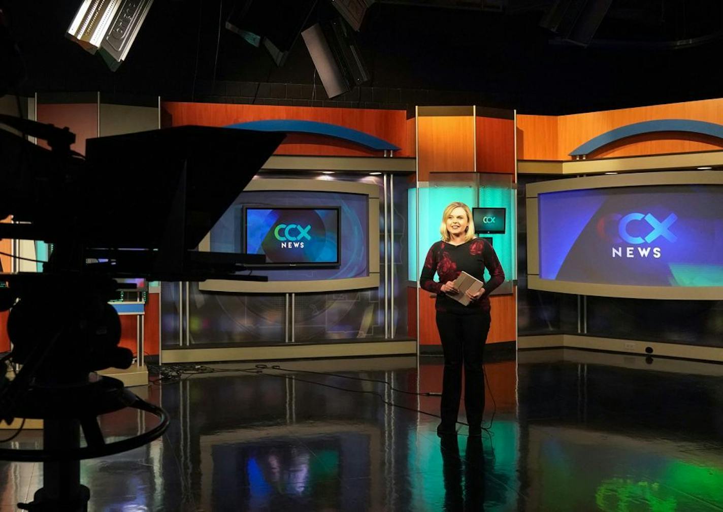 CCX Media News Director Shannon Slatton was on set during a live news broadcast Friday. The station is funded by an annual fee from private cable companies — a source that is now threatened.