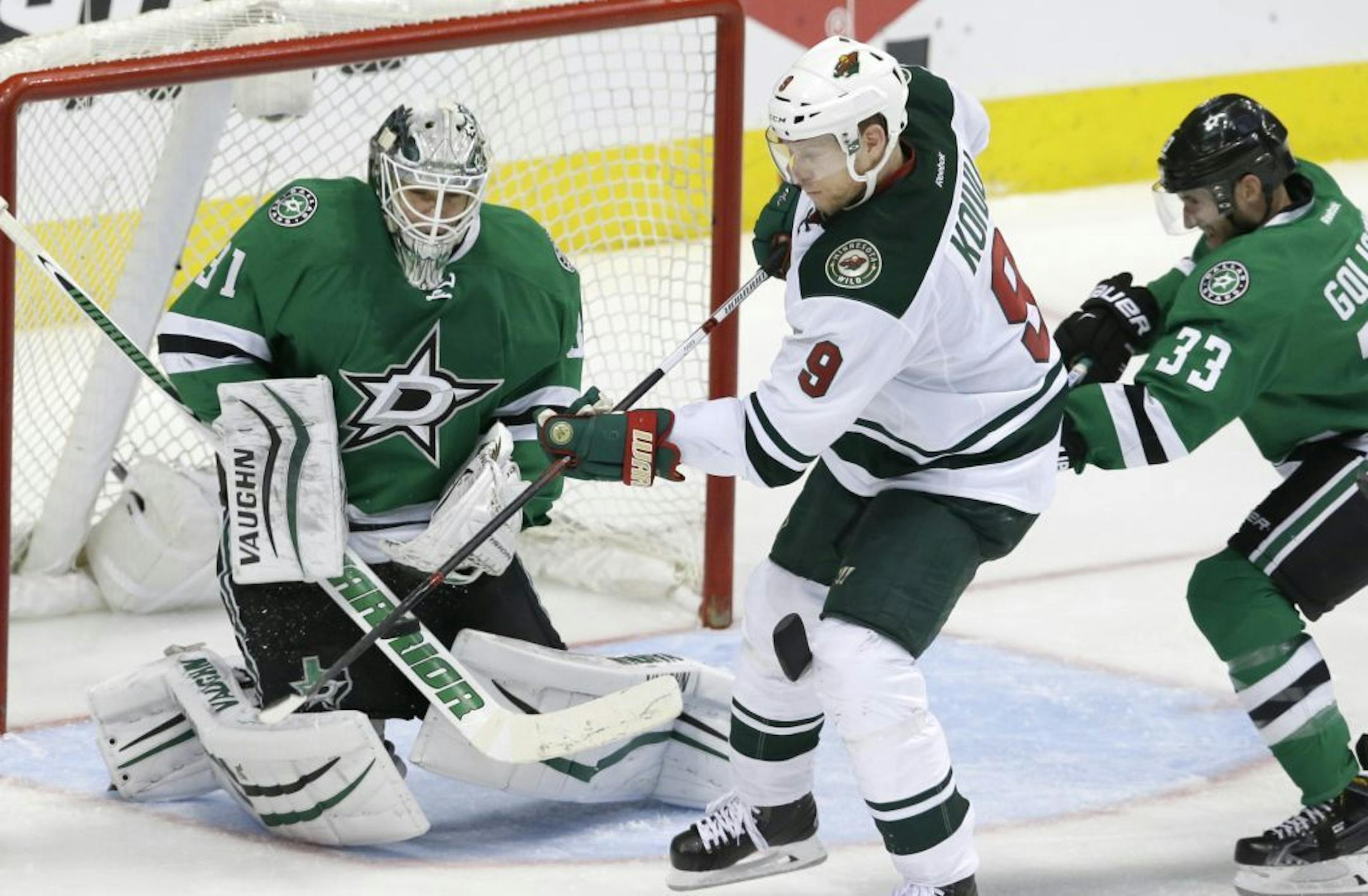 Wild center Mikko Koivu scores in over time against Dallas goalie Antti Niemi in Game 5 on Friday.