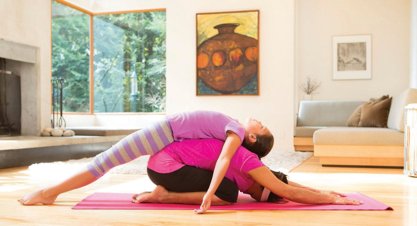 Partner yoga is a fun to keep fit.