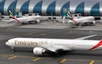 An Emirates plane taxis to a gate at Dubai International Airport at Dubai International Airport in Dubai, United Arab Emirates, on Wednesday, March 22
