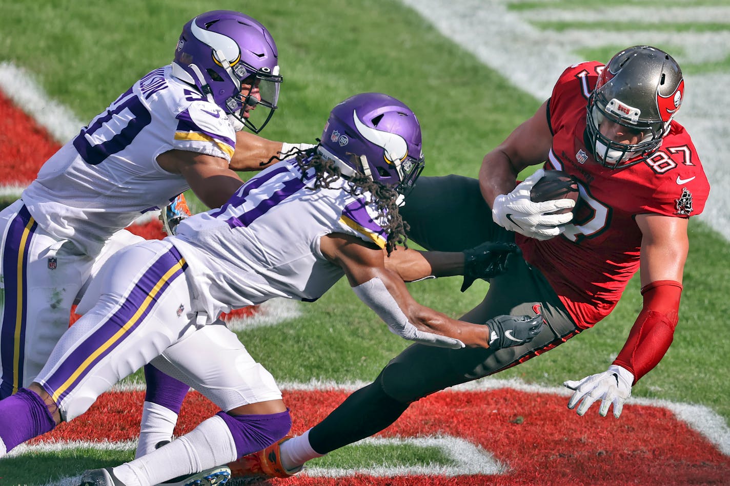 Buccaneers tight end Rob Gronkowski (87) pulls in a 2-yard touchdown pass after getting past Vikings linebacker Eric Wilson (50) and afety Anthony Harris (41) in a December game.