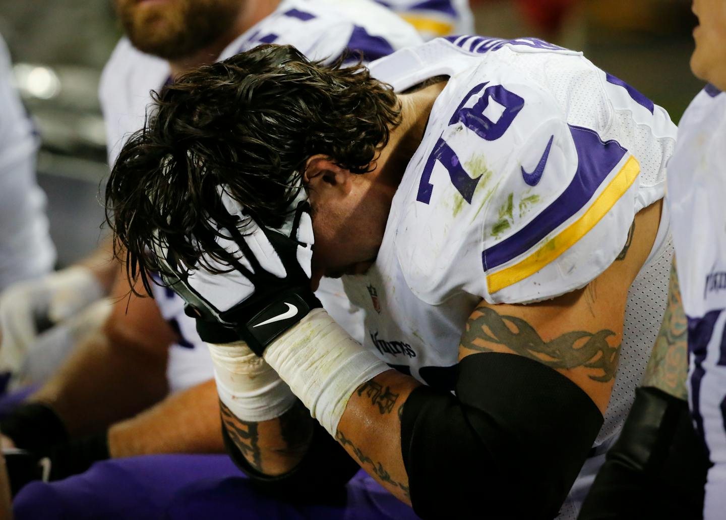 Vikings guard Alex Boone sat on the bench after being injured in the second half against the Chicago Bears on Monday.