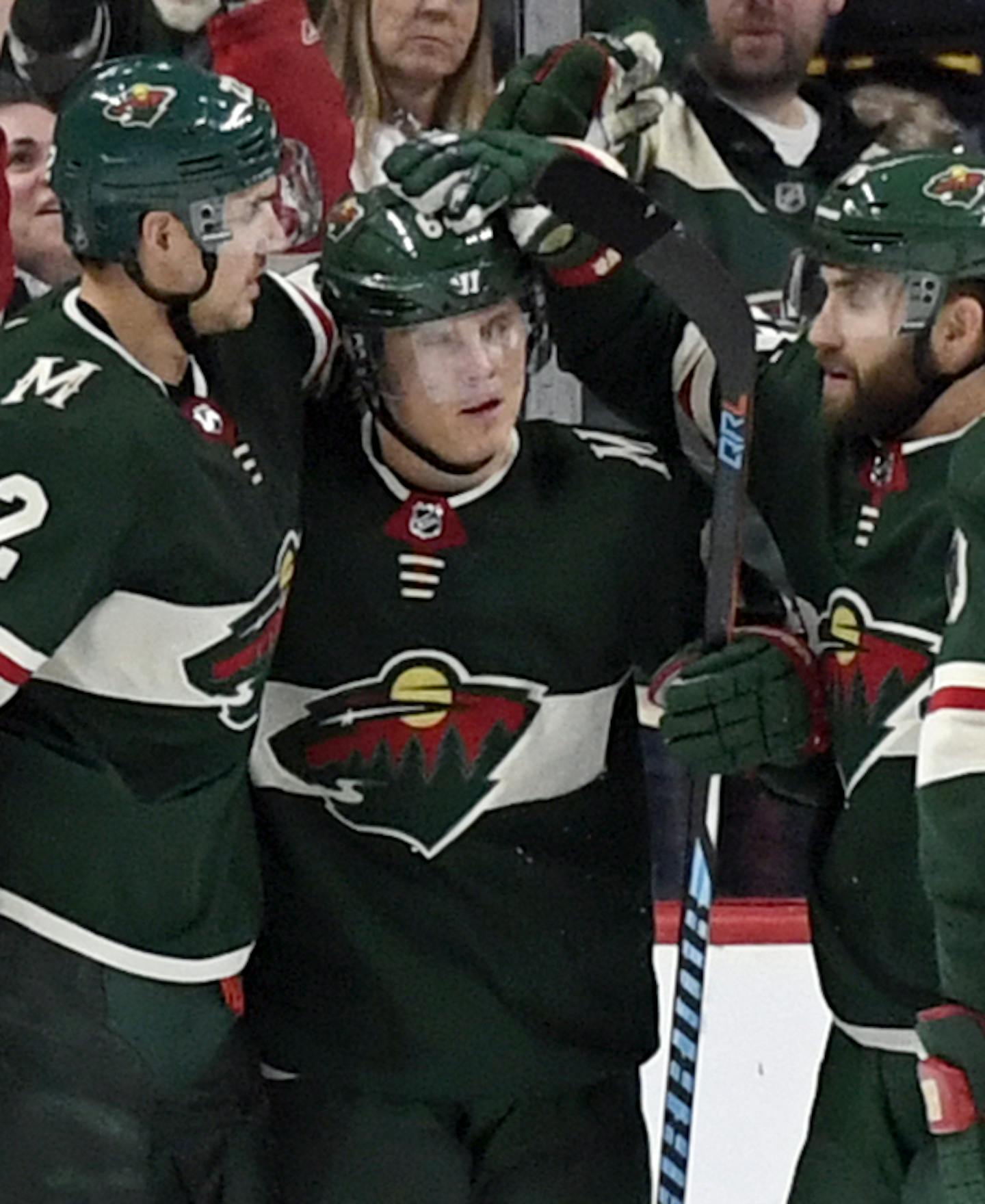 Minnesota Wild's Nino Niederreiter (22), of Switzerland, Mikael Granlund (64), of Finland, Jason Zucker (16) and Ryan Suter (20) celebrate a goal by Granlund against the Colorado Avalanche during the second period of an NHL hockey game Saturday, Oct. 27, 2018, in St. Paul, Minn. (AP Photo/Hannah Foslien)