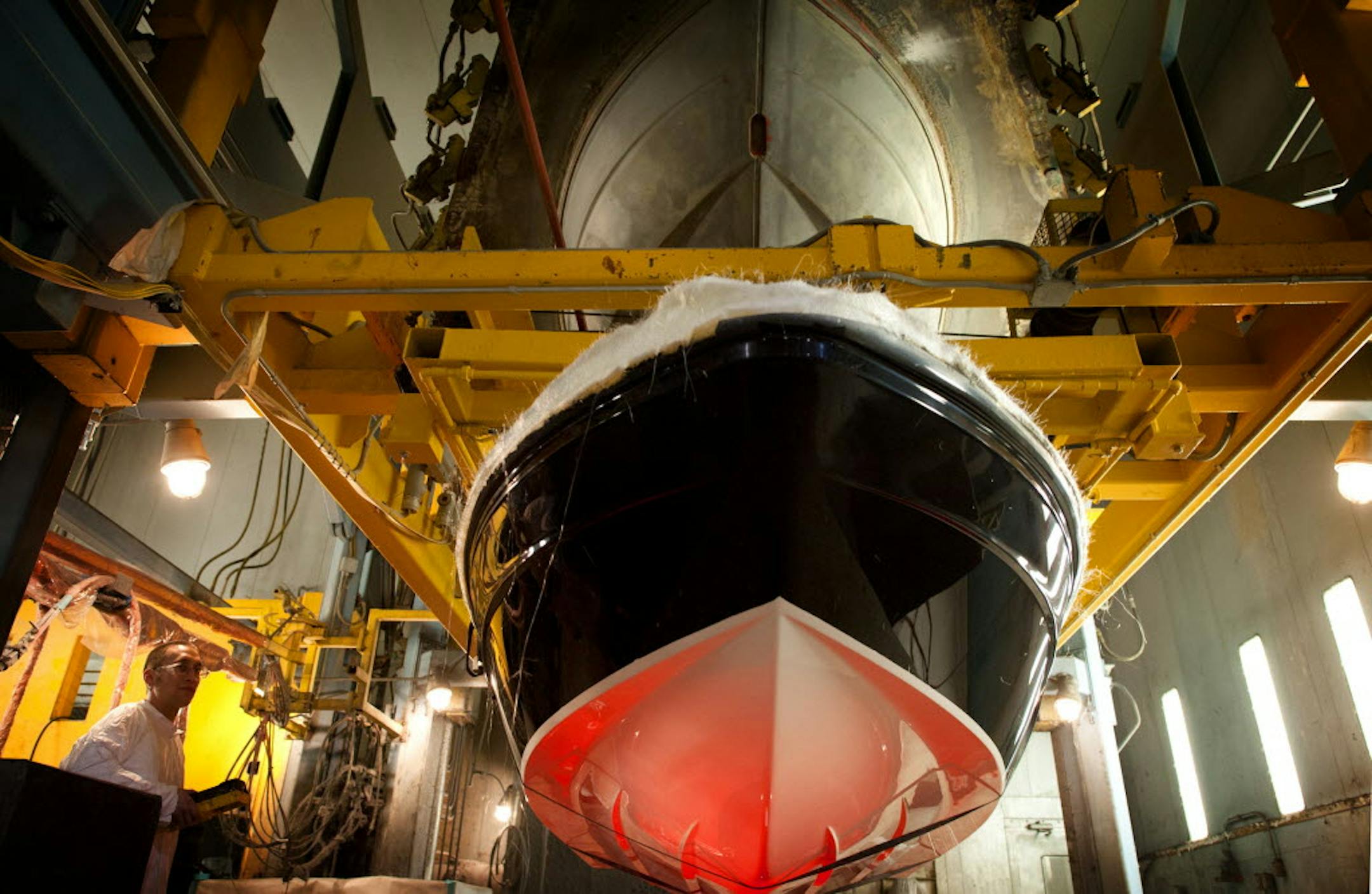 Justin Meidl worked on a Larson boat hull at the Larson Boat Group&#x2019;s plant in Little Falls, Minn., where Larson, Striper and now Triumph boats are manufactured. Larson boats have been made here since 1913.