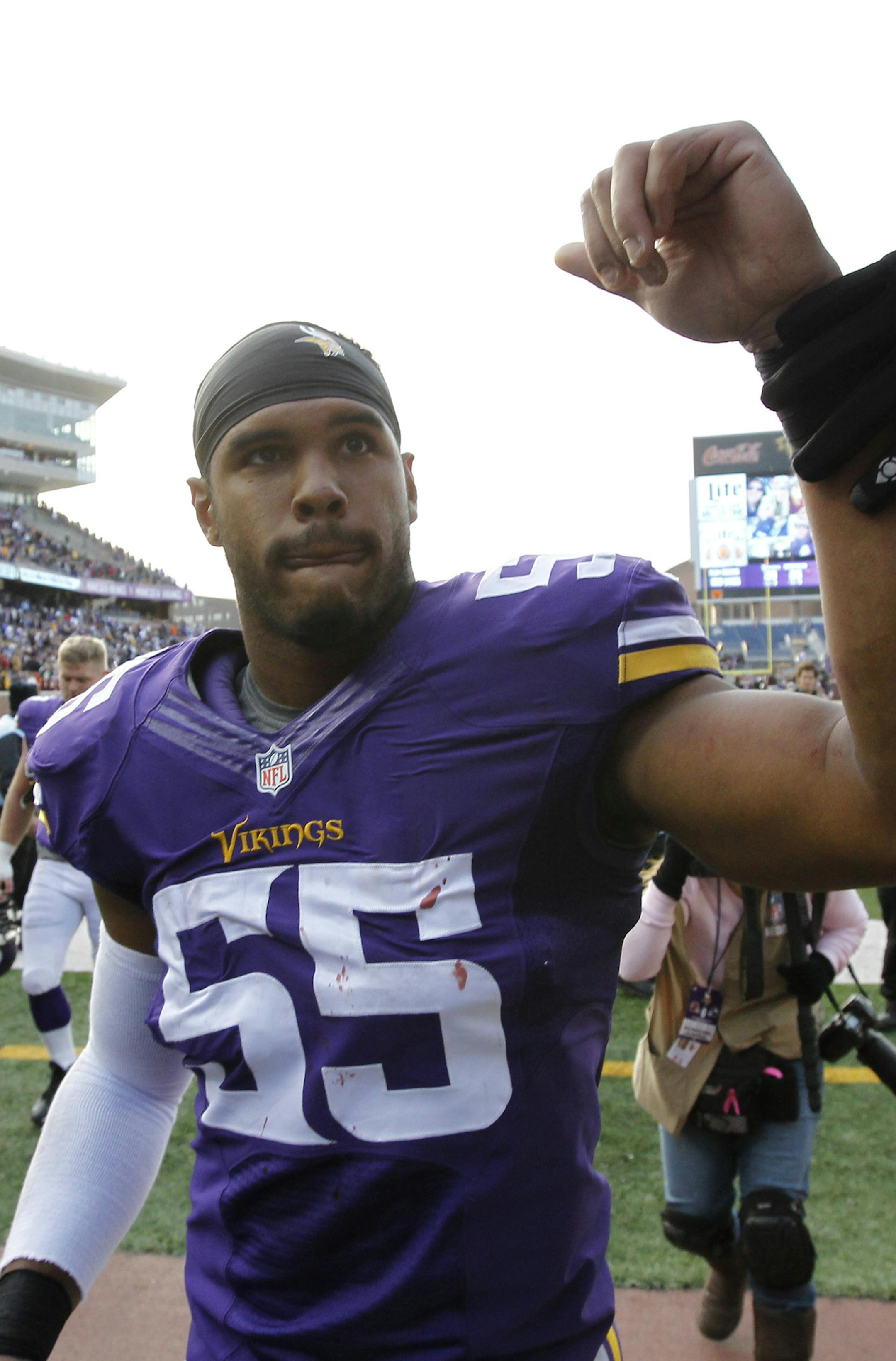 Minnesota Vikings outside linebacker Anthony Barr celebrates with fans after an NFL football game against the Washington Redskins, Sunday, Nov. 2, 2014, in Minneapolis. The Vikings won 29-26. (AP Photo/Ann Heisenfelt)