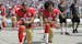 On Sept. 18, San Francisco 49ers' Colin Kaepernick (7) and Eric Reid (35) kneel during the national anthem before an NFL football game against the Car