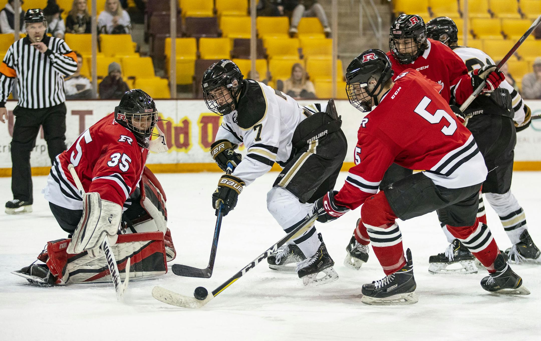 Andover forward Luke Kron (7) tried to move in on Elk River goalkeeper Josh Koziol (35) in the first period but had his shot broken up. Photo: ALEX KORMANN • alex.kormann@startribune.com