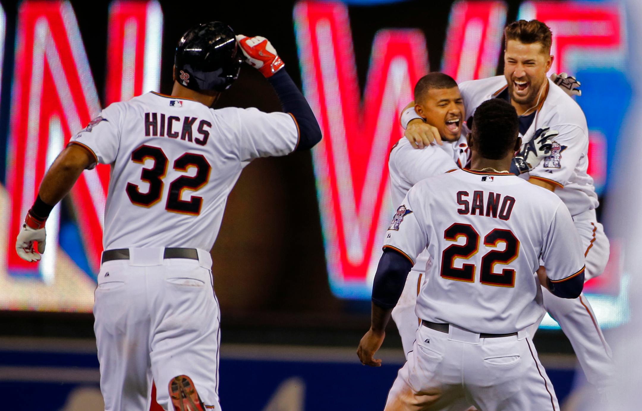 The Twins celebrate Eduardo Escobar's walk-off double that scored Kurt Suzuki for the 3-2 win.