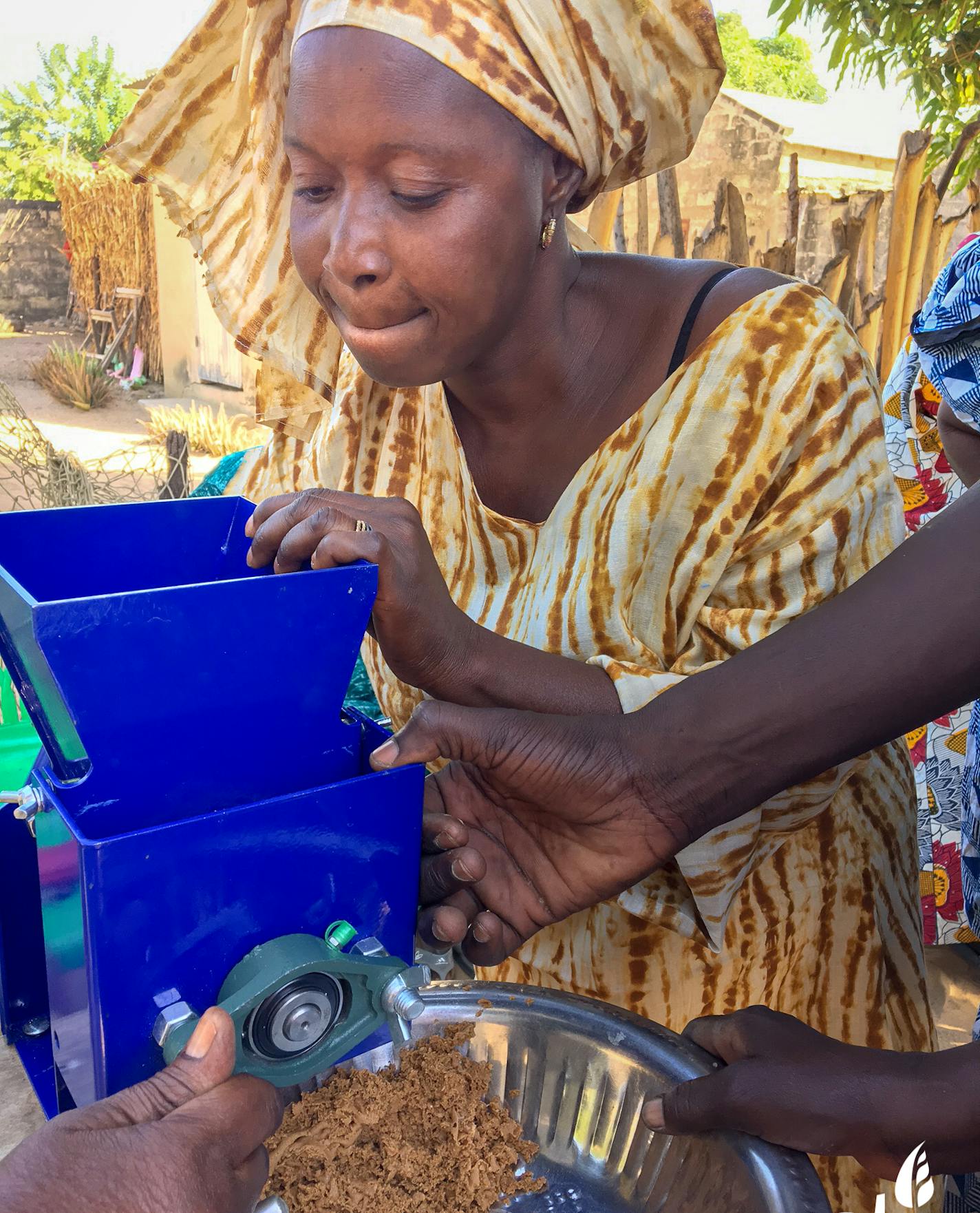 Ana, a Senagalese farmer, uses a simple CTI "Ewing VI" grinder to process crops into flour, paste or peanut butter that increases productivity, income and local health.