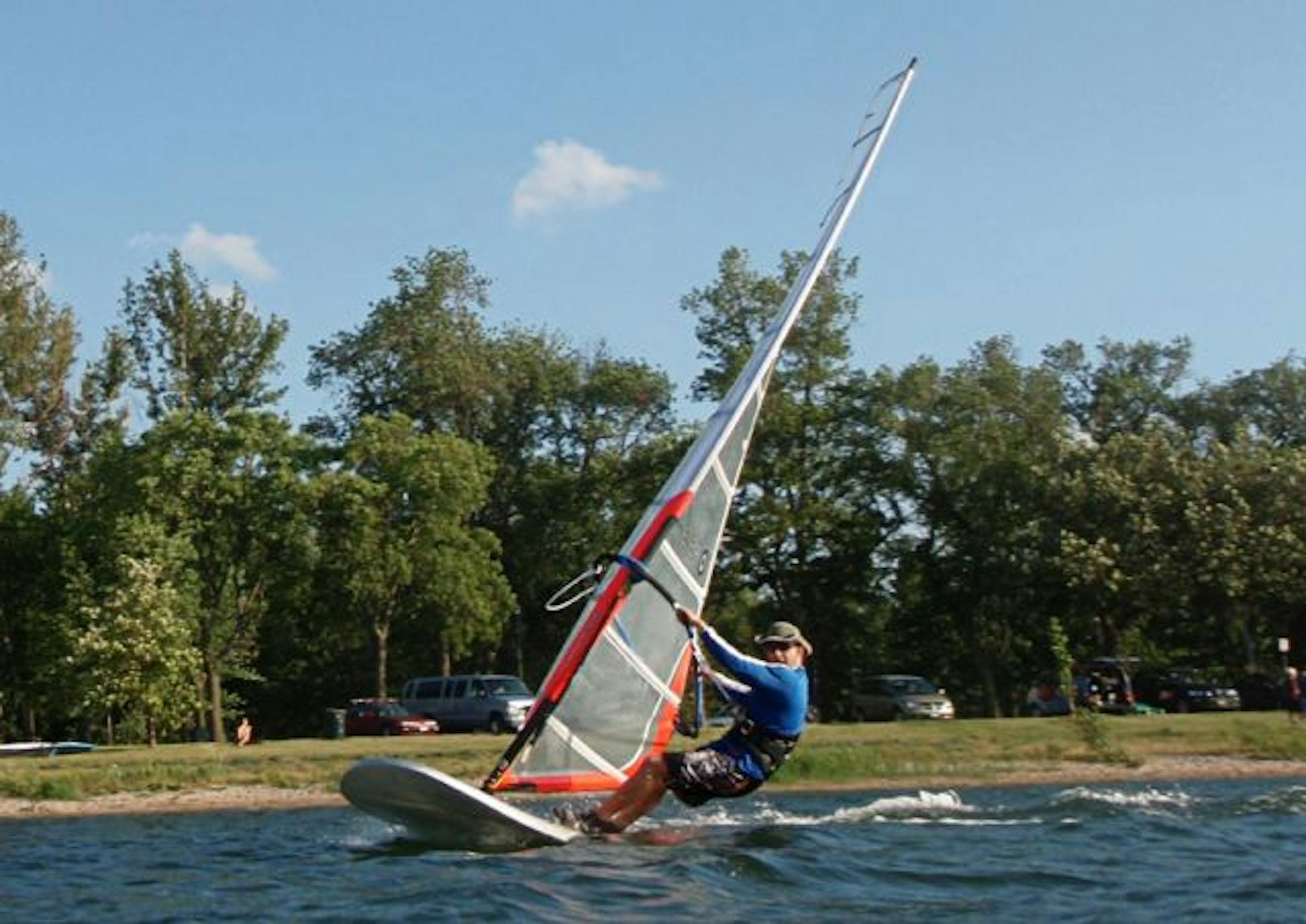 Mike Chummers windsurfed on Lake Calhoun, where windsurfers are afraid they're going to get squeezed out by a parking lot redesign and lose their access to the lake.