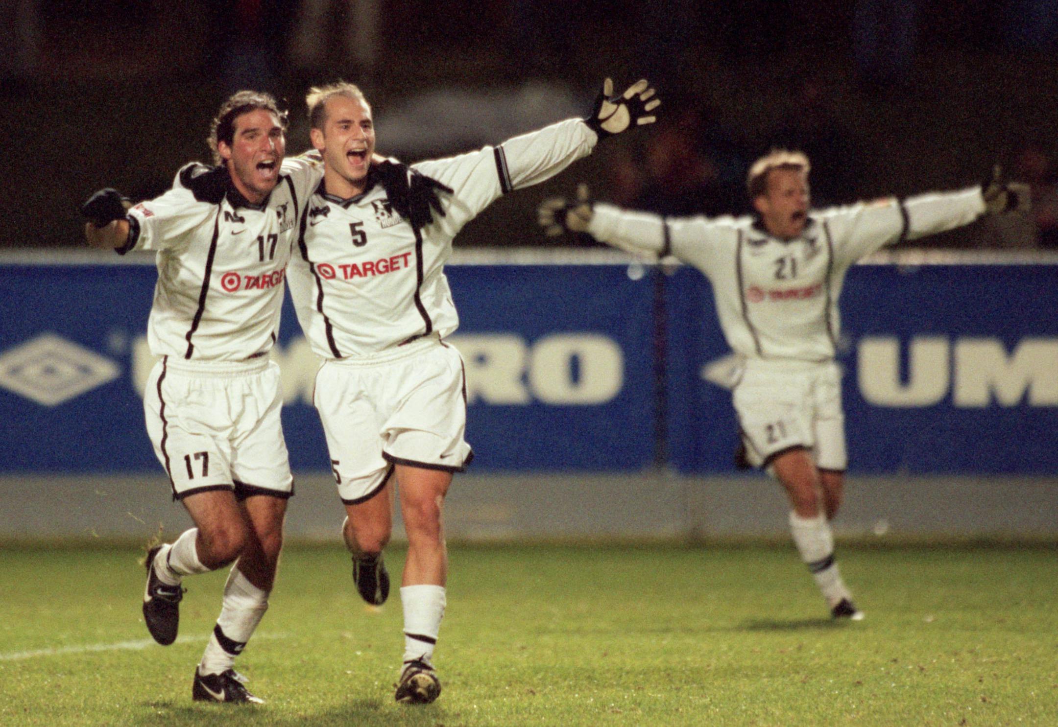 Aaron Leventhal, Mike Gentile, and Don Gramenz celebrate the Minnesota ThunderÌs win over the Rochester Raging Rhinos.
