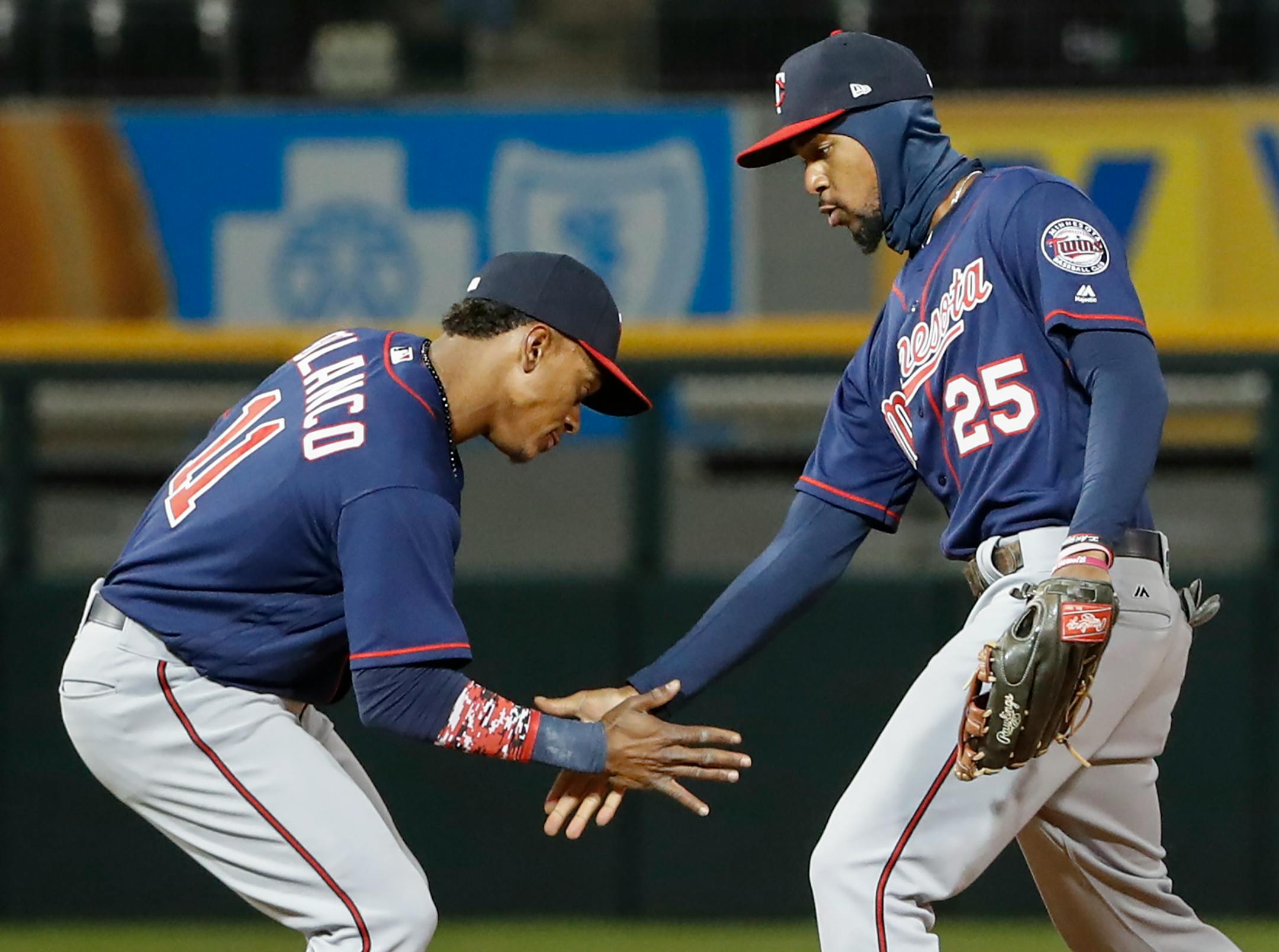 Minnesota Twins shortstop Jorge Polanco (11) celebrates with center fielder Byron Buxton (25) after their win over the Chicago White Sox, Friday, April 7, 2017, in Chicago. (AP Photo/Kamil Krzaczynski)