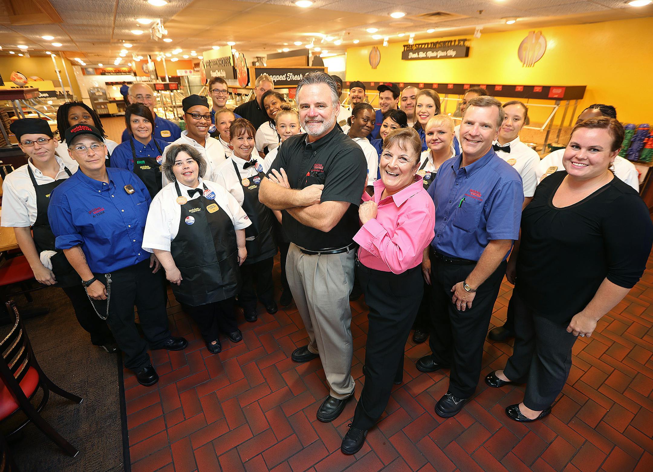 Golden Corral Franchisee Dale Maxfield, center, plans to open as many as seven buffet style restaurants in the Twin Cities. Here his Maple Grove employees gathered around him, Wednesday, August 31, 2016 in Maple Grove, MN. ] (ELIZABETH FLORES/STAR TRIBUNE) ELIZABETH FLORES &#x2022; eflores@startribune.com