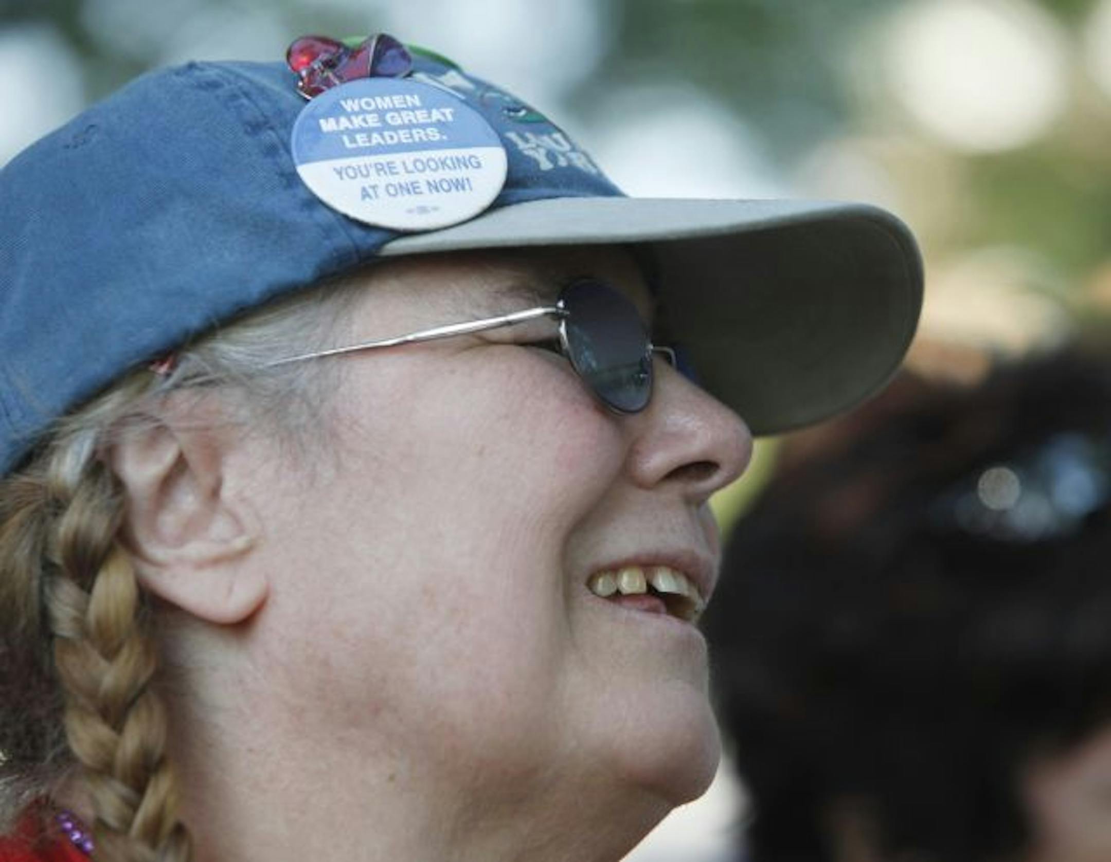 Mary Schoenleber, of Bloomington, listened to the candidates during the DFL debate at the fair on Tuesday.