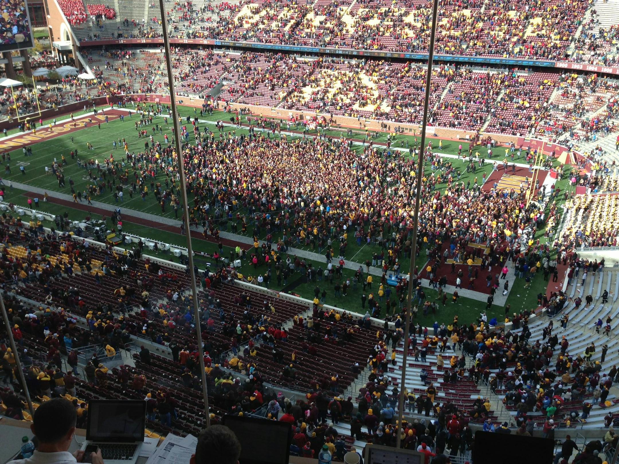 Gophers fans stormed the TCF Bank Stadium field Saturday, Oct. 26, 2013, after Minnesota upset 24th-ranked Nebraska 34-23.