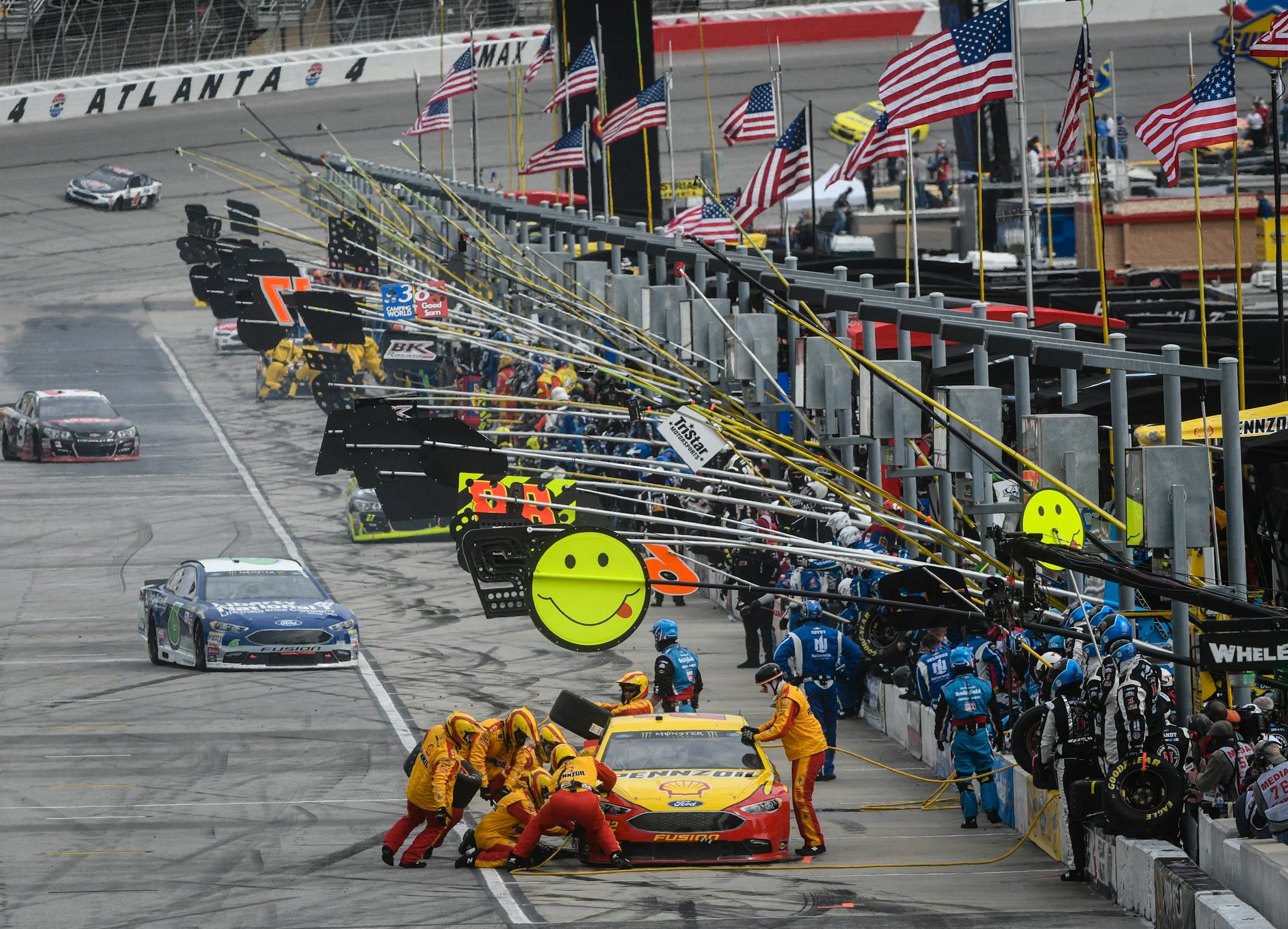 The car driven by Joey Lagano, right, made a pit stop during a NASCAR Monster Cup series auto race at Atlanta Motor Speedway in Hampton, Ga., on Sunday.