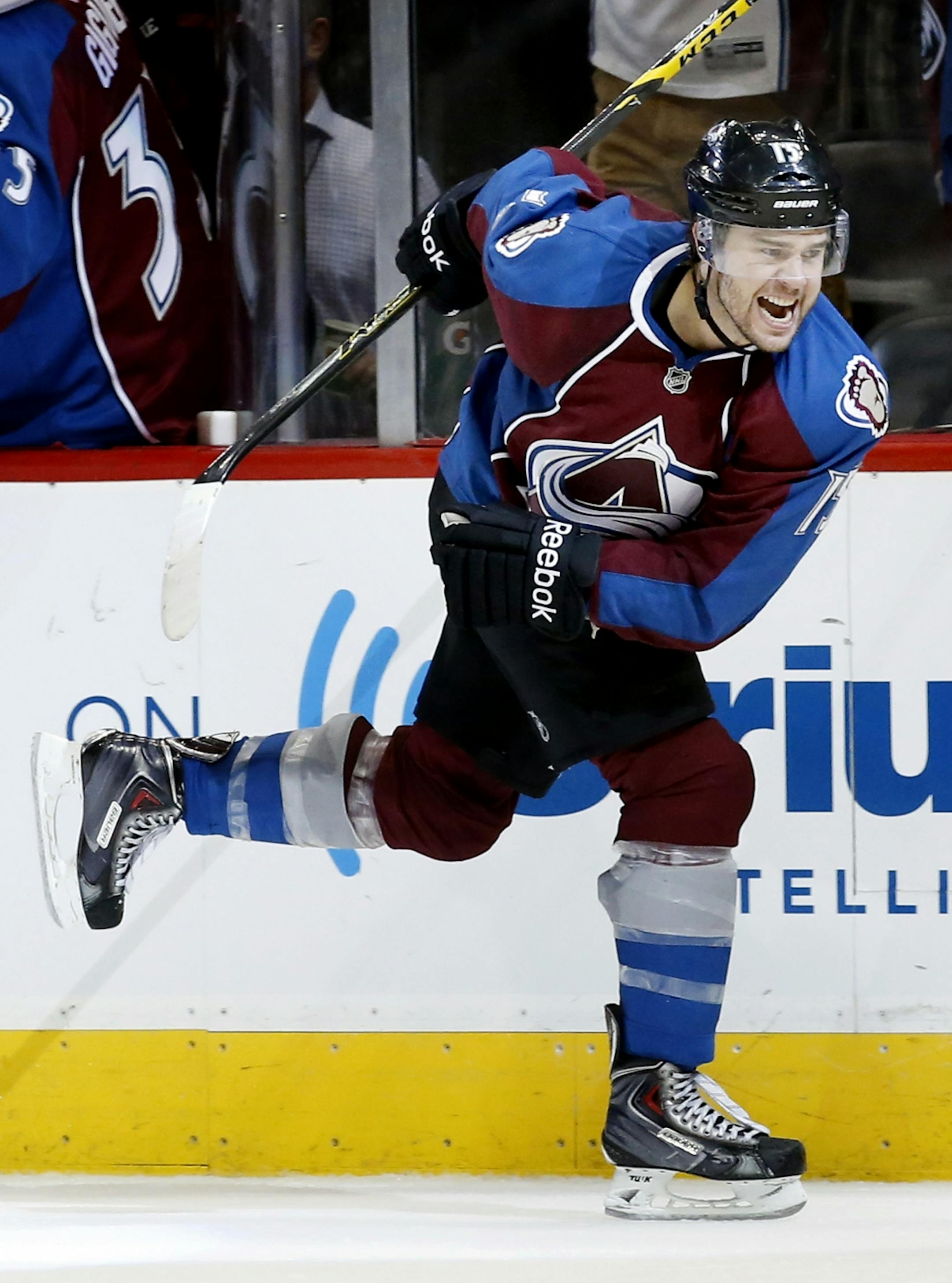 PA Parenteau (15) celebrated after scoring a goal in the third period to tie the game.