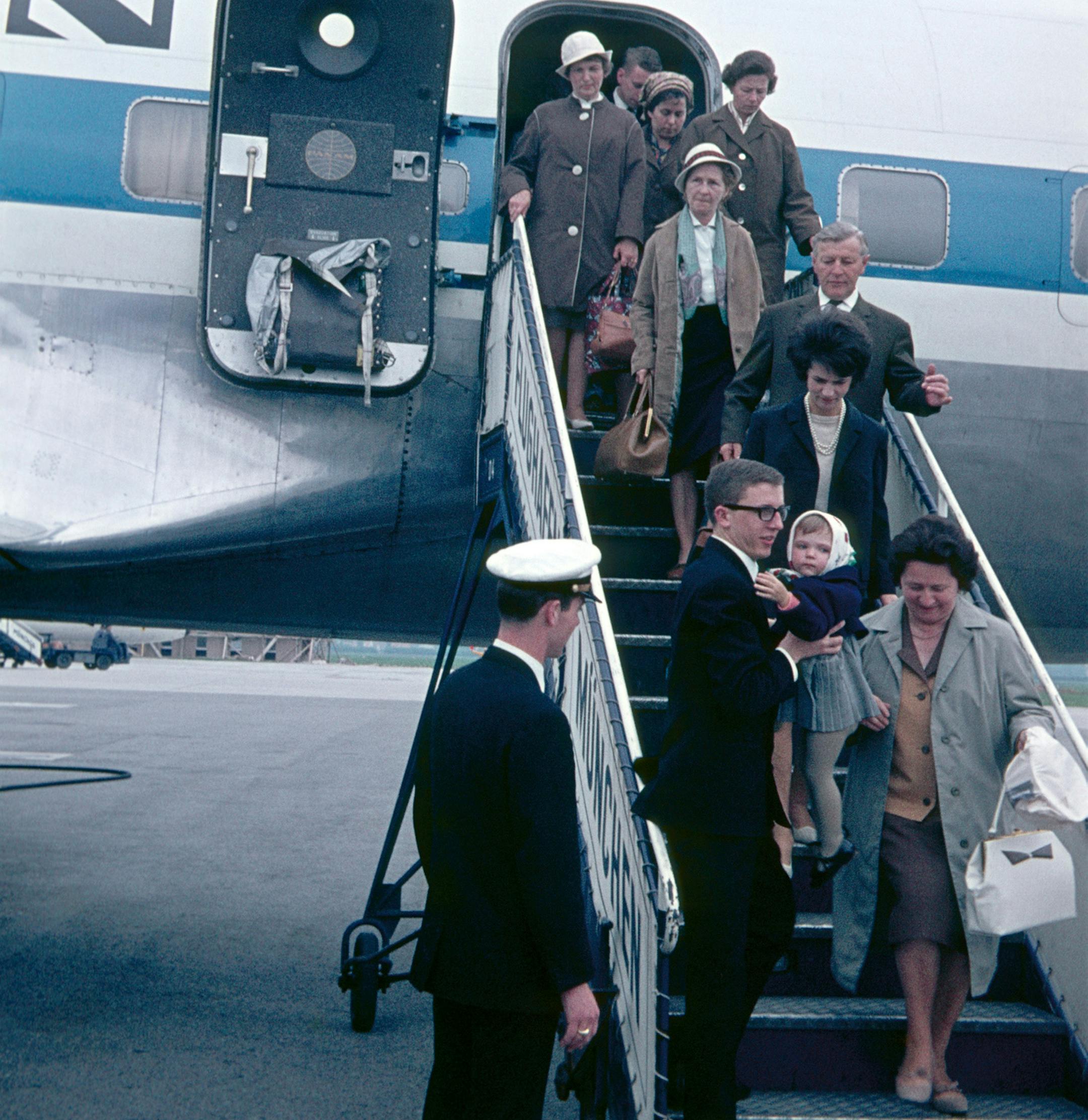 Munich, Bavaria, Germany, 1965. Passenger leaving the plane after landing in Munich. At the time, a gangway was needed as the aircraft were still parked on the airfield.