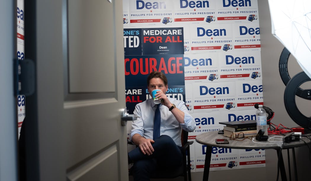 Democratic presidential candidate Dean Phillips’ sipped coffee Friday in the interview room of his New Hampshire campaign headquarters. 