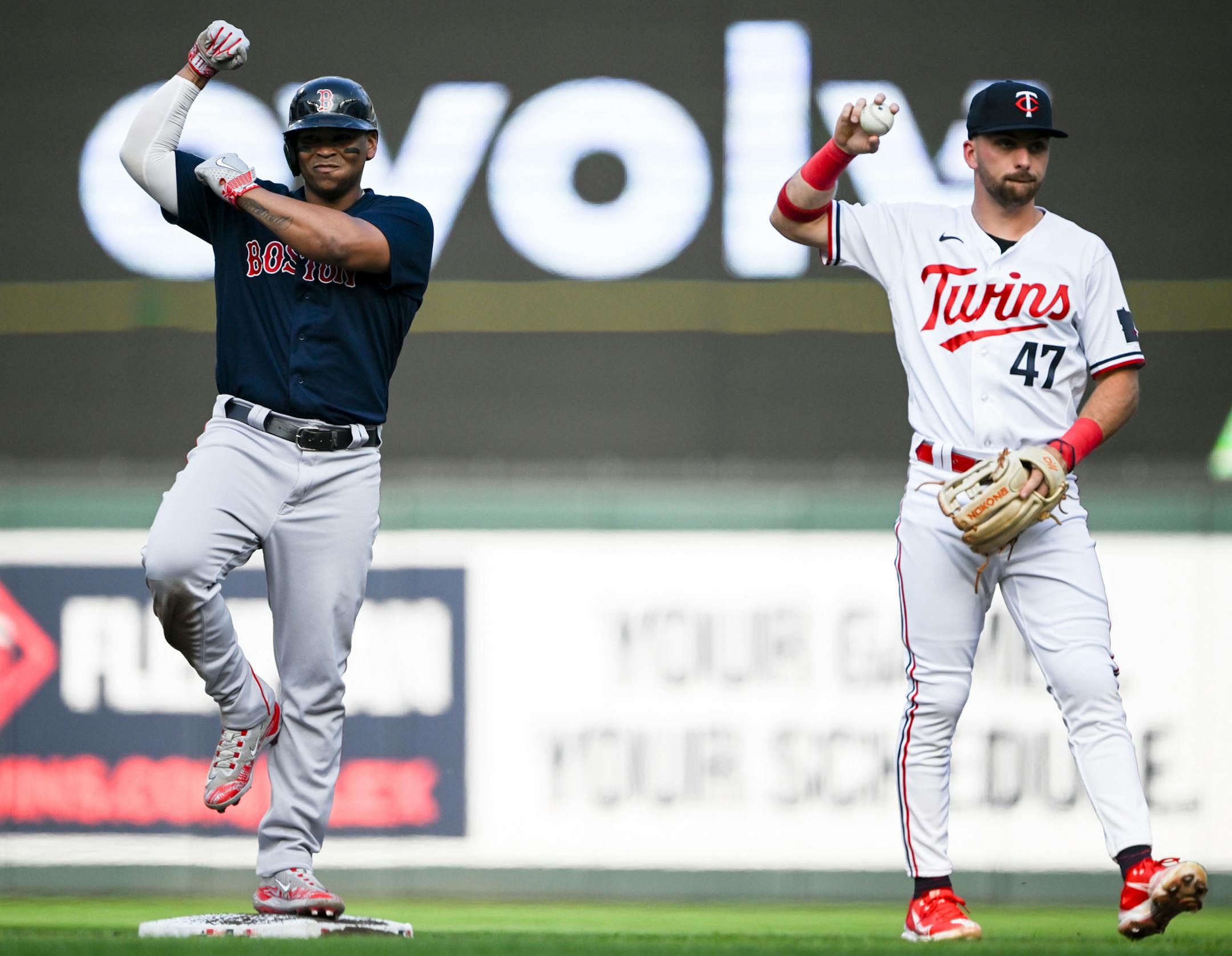 Boston Red Sox third baseman Rafael Devers (11) reacts after hitting an RBI double against the Minnesota Twins in the top of the first inning Wednesday, June 21, 2023, at Target Field in Minneapolis, Minn.