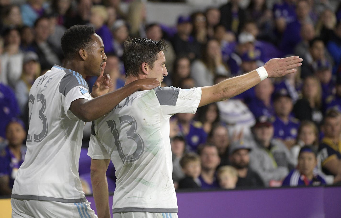 Minnesota United forward Mason Toye (23) congratulates midfielder Ethan Finlay (13) after Finlay scored a goal during the second half of an MLS soccer match against the Orlando City Saturday, March 10, 2018, in Orlando, Fla. Minnesota won 2-1. (Phelan M. Ebenhack for the Star-Tribune) ORG XMIT: OTKMINN106 ORG XMIT: MIN1803102049297377