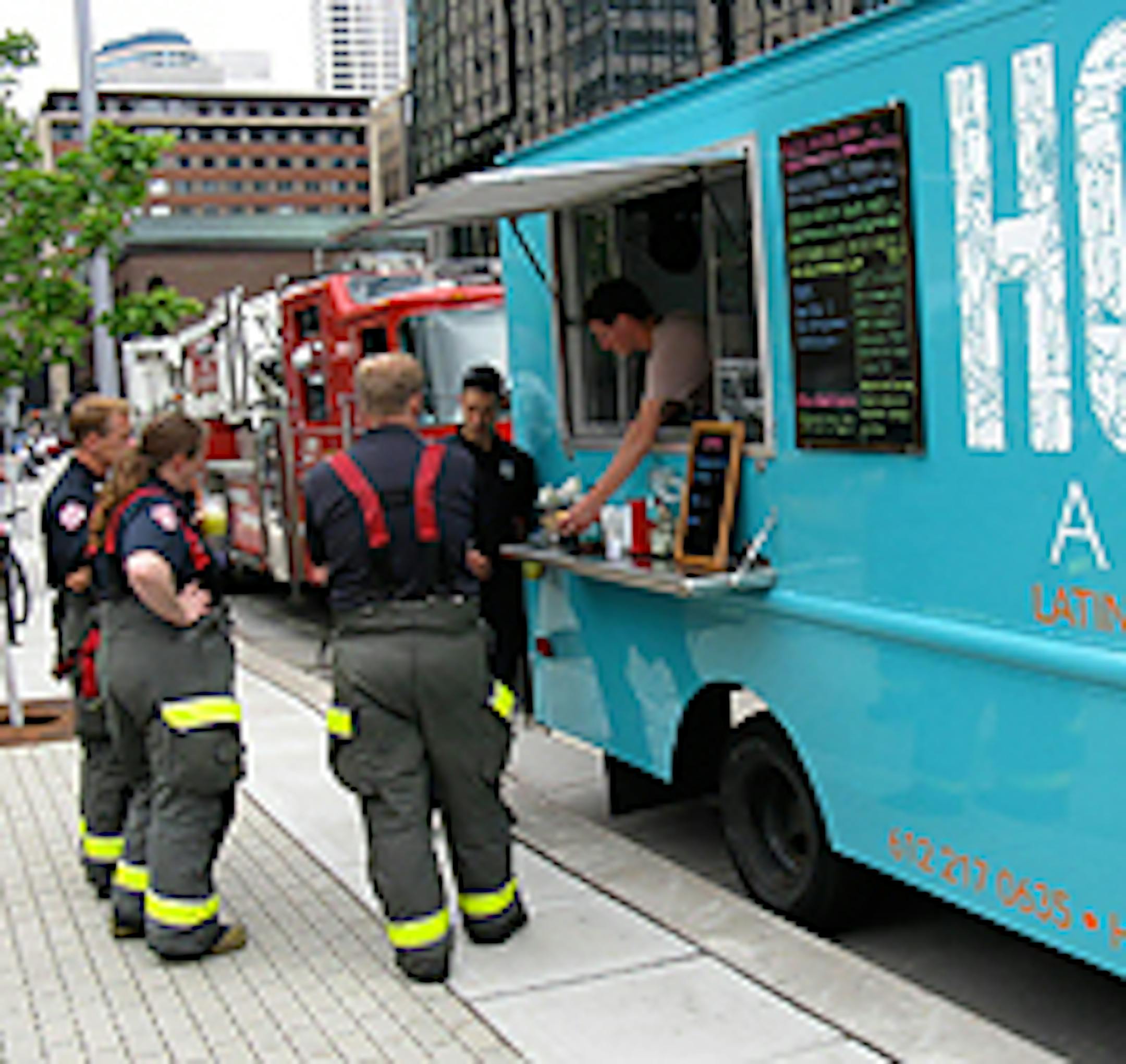 Firefighters waiting in line at Hola Arepa