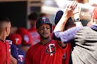 Minnesota Twins center fielder Byron Buxton (25) celebrated with his teammates in the dugout after scoring in the sixth inning.