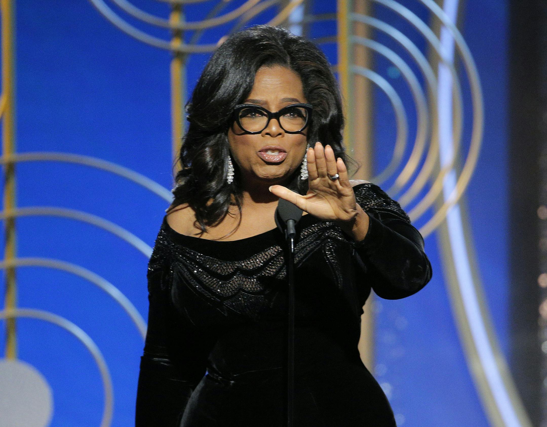 This image released by NBC shows Oprah Winfrey accepting the Cecil B. DeMille Award at the 75th Annual Golden Globe Awards in Beverly Hills, Calif., on Sunday, Jan. 7, 2018. (Paul Drinkwater/NBC via AP)