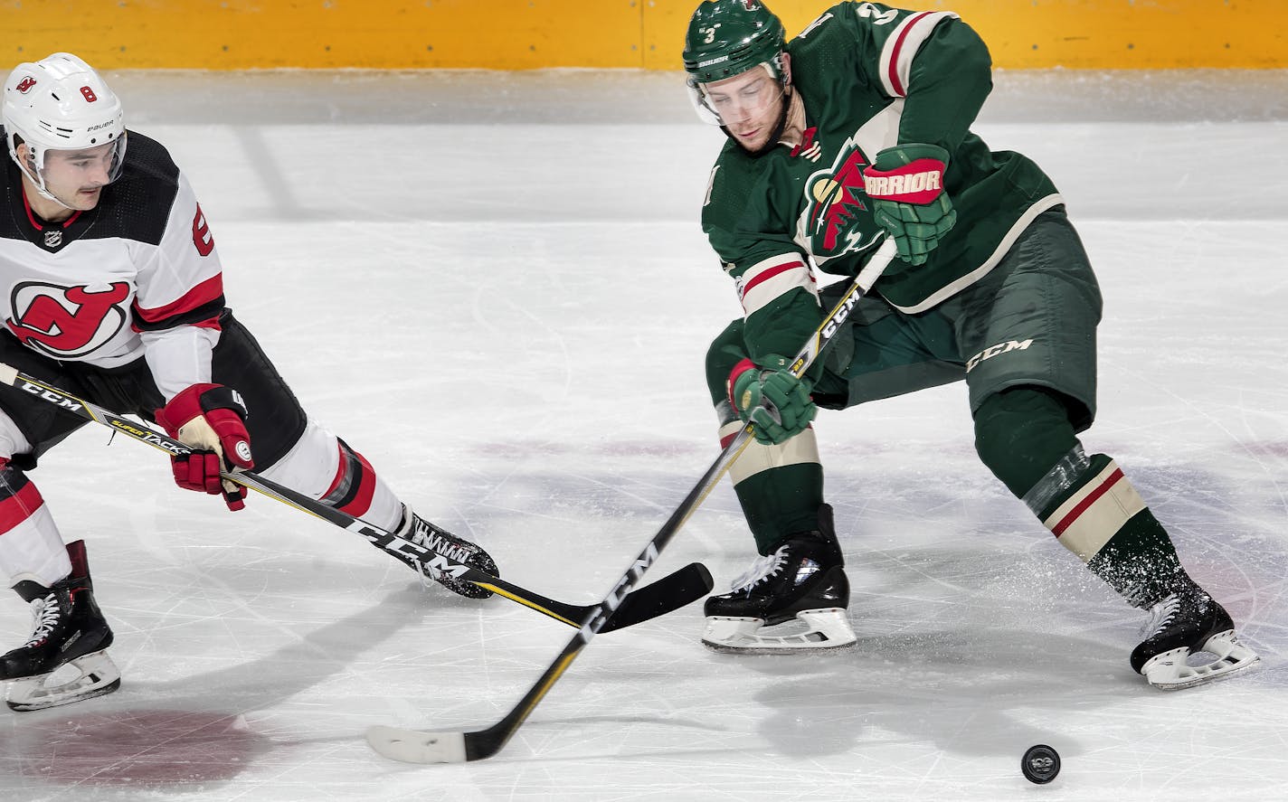 Will Butcher (8) and Charlie Coyle (3) fought for the puck in the second period. ] CARLOS GONZALEZ &#xef; cgonzalez@startribune.com - November 20, 2017, St. Paul, MN, Xcel Energy Center, NHL, Hockey, Minnesota Wild vs. New Jersey Devils