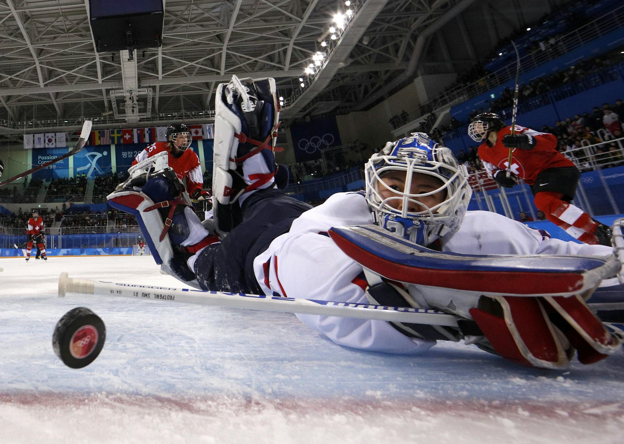 South Korea's goalie Shin So-jung (31), of the combined Koreas team, watches the puck goes into the goal shot by Phoebe Staenz (88), of Switzerland, during the second period of the preliminary round of the women's hockey game at the 2018 Winter Olympics in Gangneung, South Korea, Saturday, Feb. 10, 2018. (Brian Snyder/Pool Photo via AP)