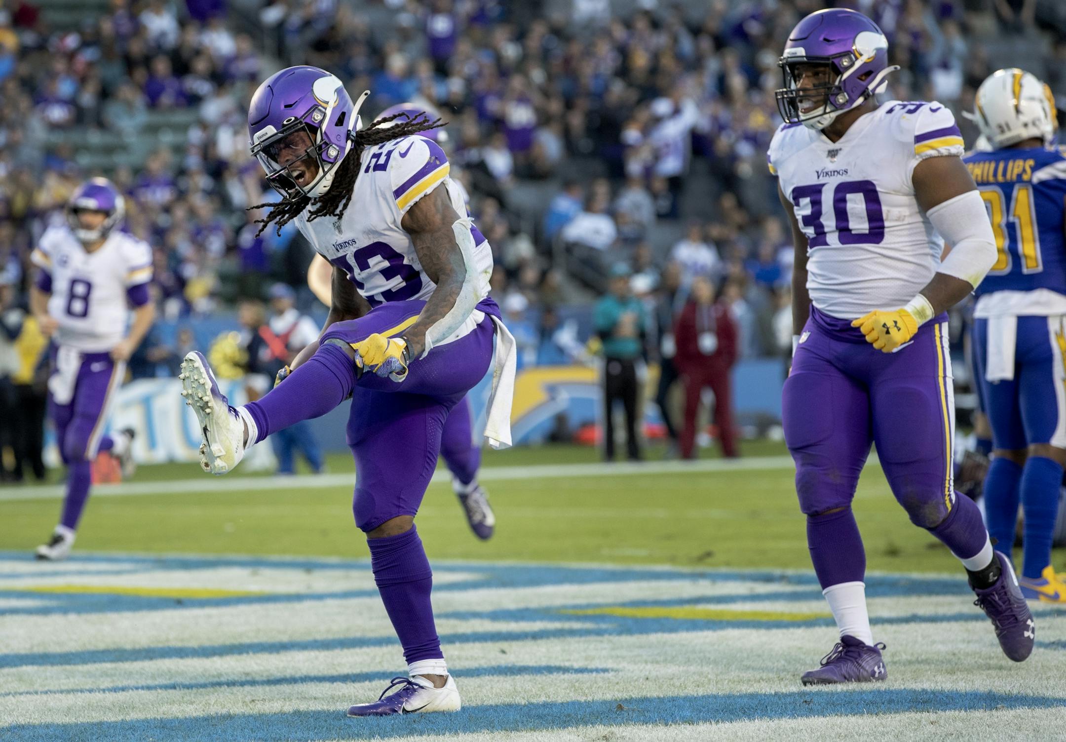Vikings running back Mike Boone (23) celebrated after scoring his second touchdown on the fourth quarter on Sunday.