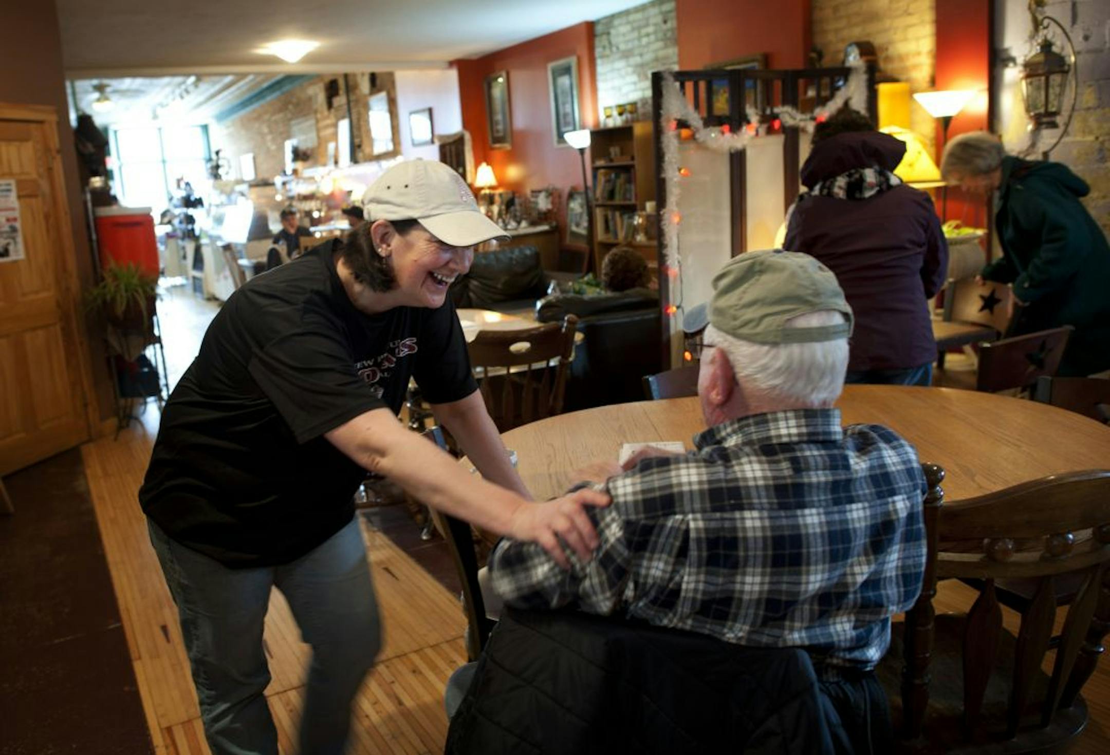 Chameleon Coffee shop owner Rhonda Doerr chatted with long time customer Richard Lucas in her New Prague shop Due to redistricting the coffee shop is now in Democrat Tim Walz congressional district, across the street is Republican John Kline's district. The town is now split in half due to redistricting. Friday, February 24, 2012