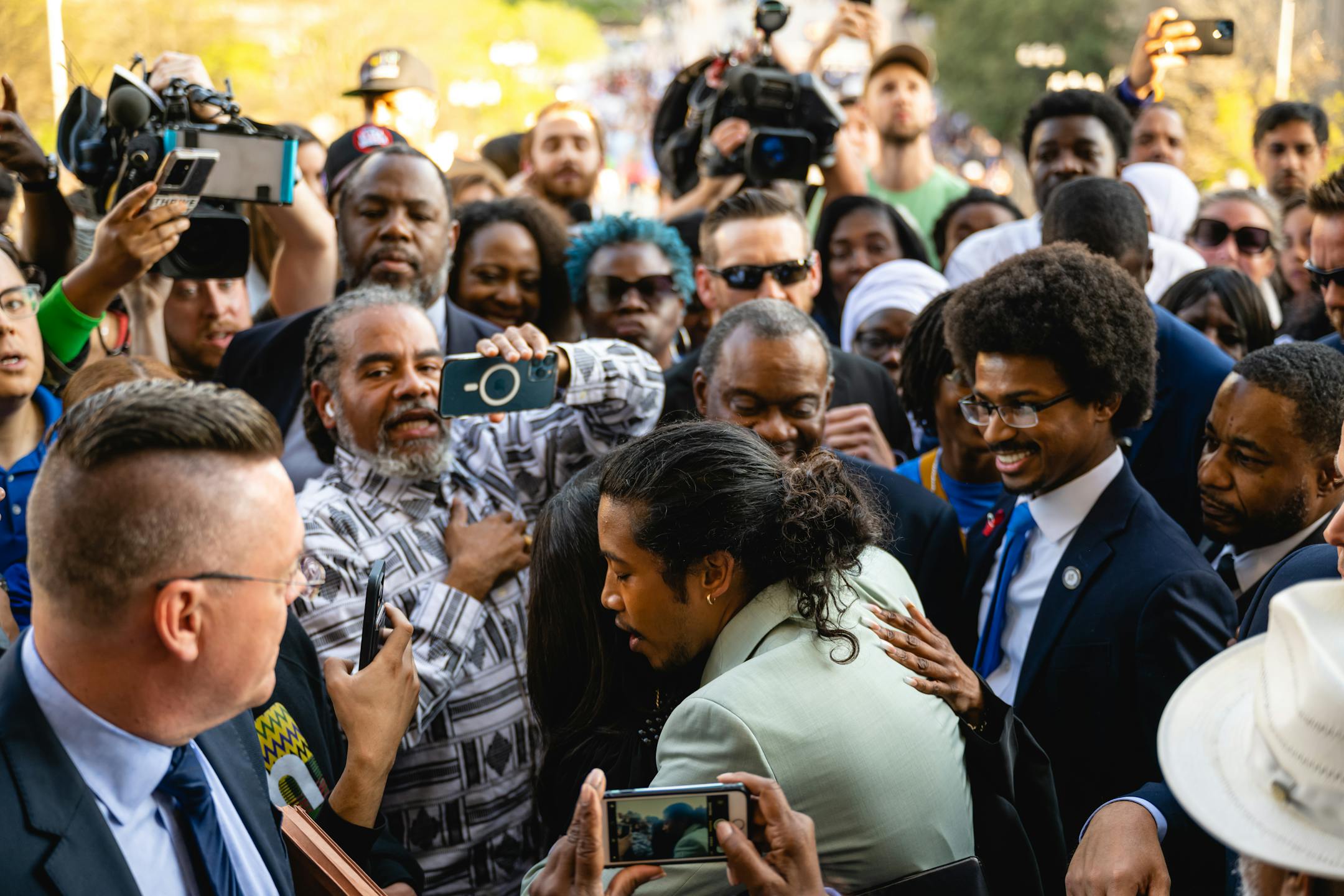 After he was reinstated to the Tennessee House of Representatives, State Rep. Justin Jones hugs I'Ashea Myles, Nashville's chancellor, as Justin Pearson, right, looks on, on the steps of the State Capitol in Nashville on April 10, 2023. We like to look to the horizon instead of to the soil because we bury the people we do not care about in the South, Tressie McMillan Cottom writes. (Jon Cherry/The New York Times)
